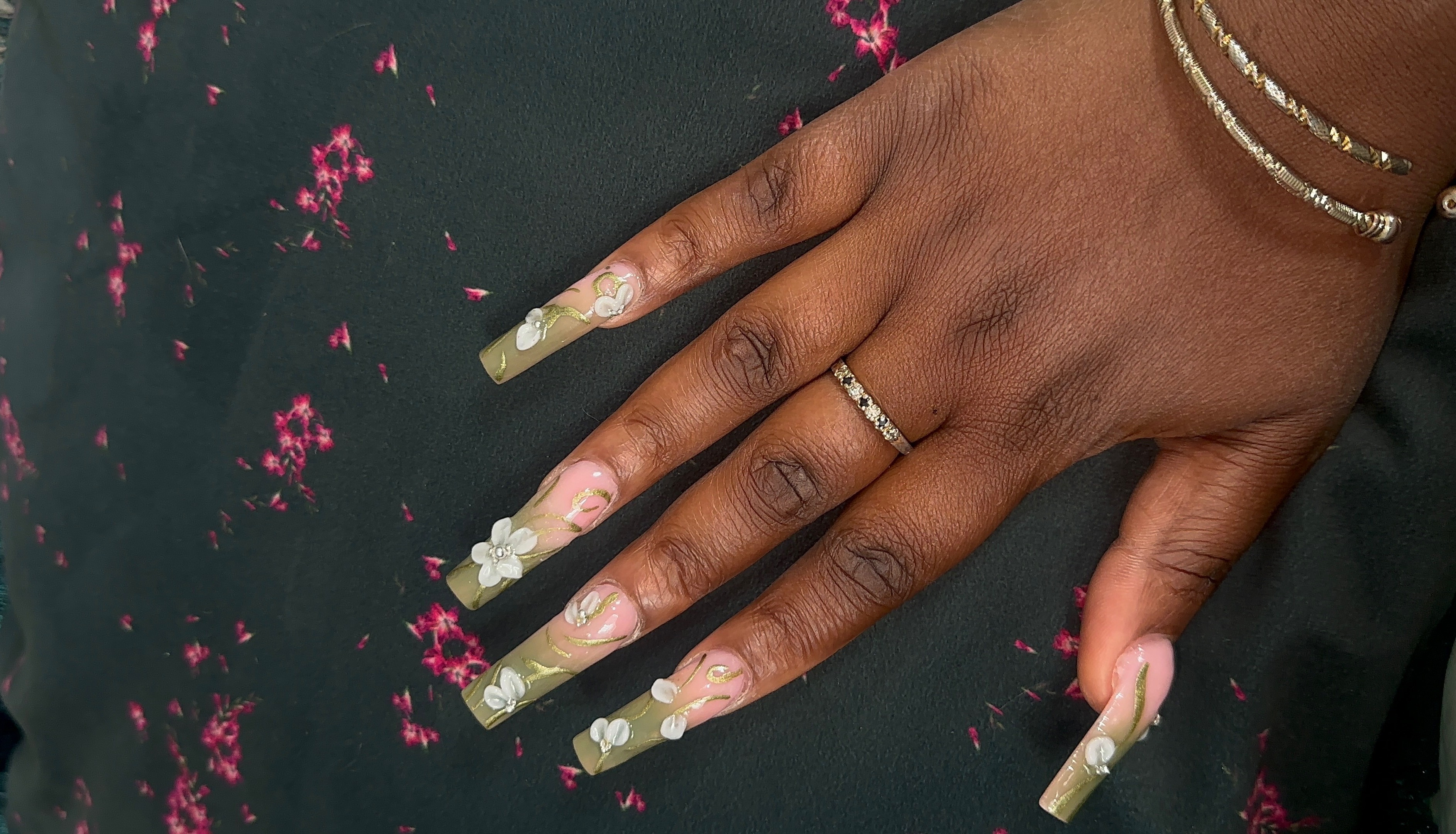 Olive green acrylic nails with 3D white flowers by Ferro's Nail Bar