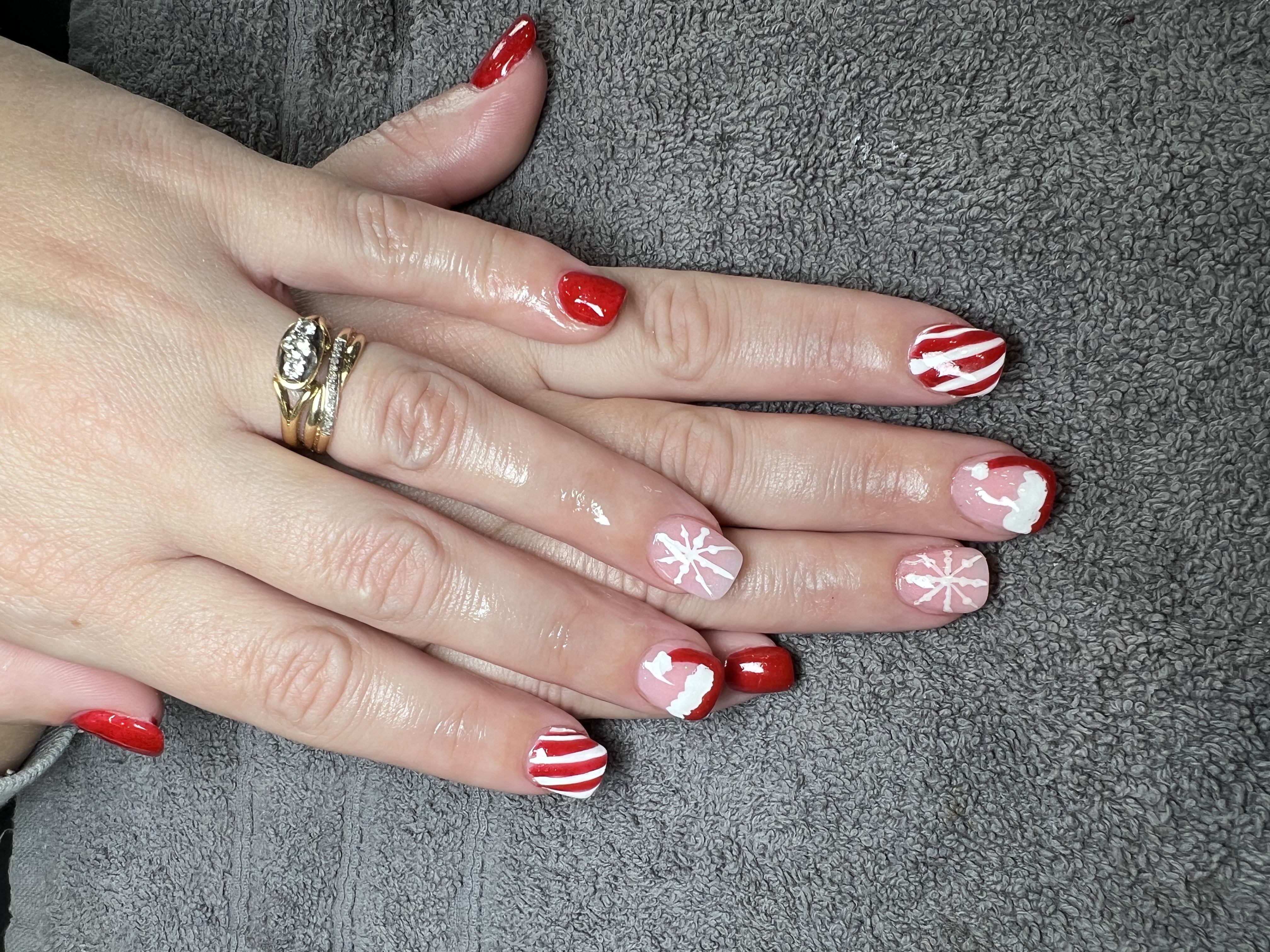 Christmas nail art — red candy cane and snowflake design